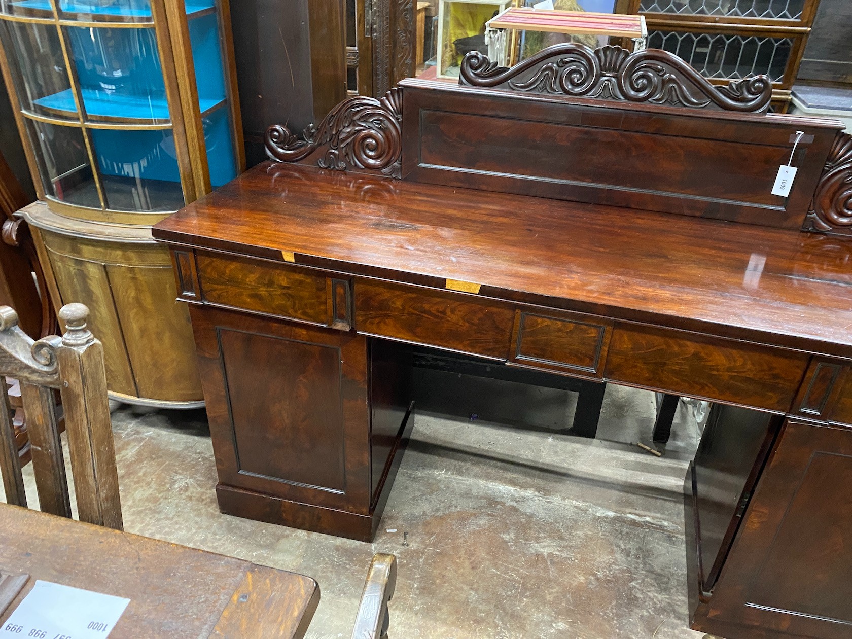 An early Victorian mahogany pedestal sideboard, length 190cm, depth 56cm, height 132cm